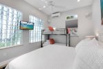 Guest Room with King Bed / Bunk Beds and flat screen TV